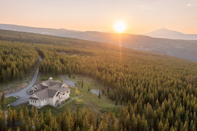 aerial view at dusk featuring a mountain view