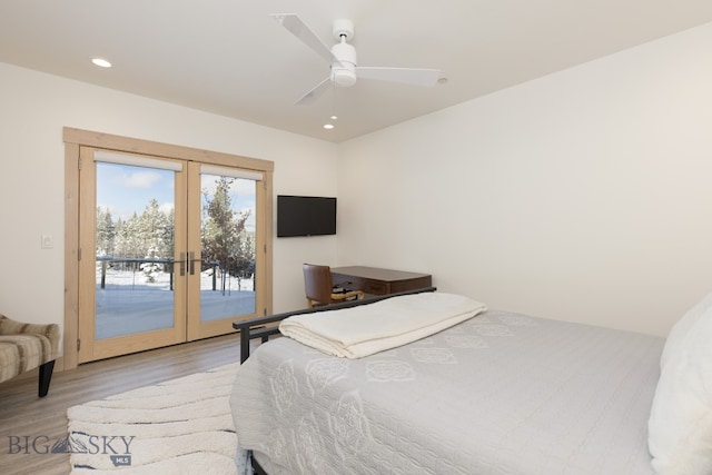 bedroom featuring french doors, access to outside, ceiling fan, and light wood-type flooring