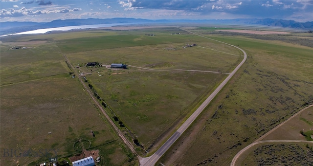 drone / aerial view featuring a mountain view and a rural view