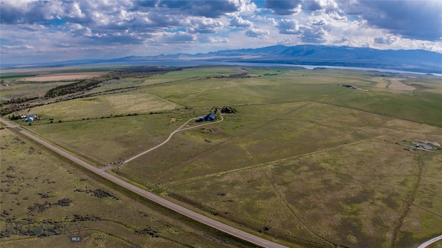 birds eye view of property featuring a rural view and a mountain view