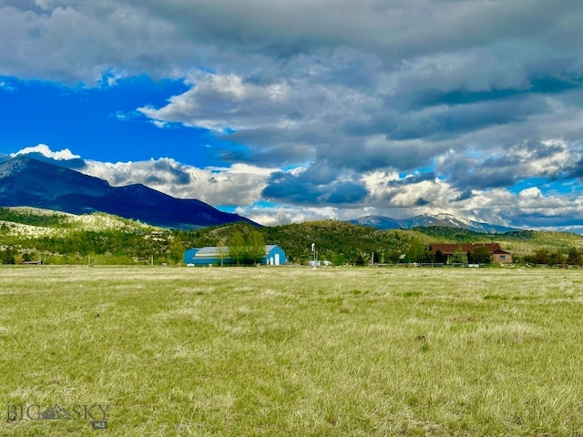 view of mountain feature with a rural view