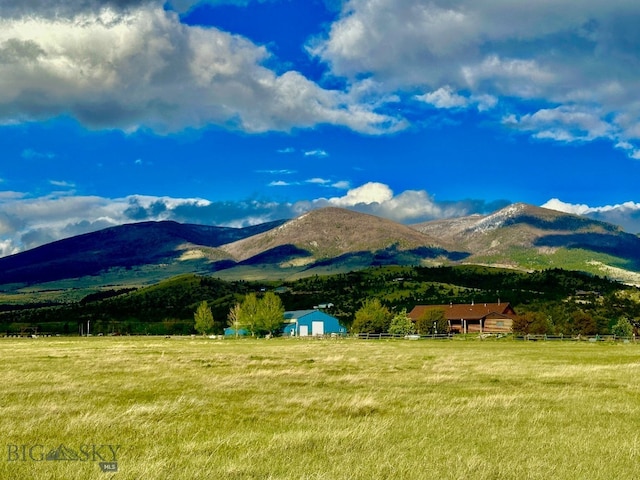 mountain view featuring a rural view