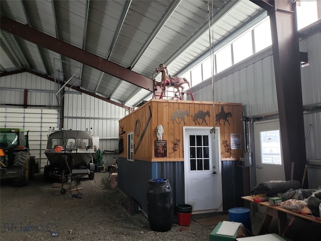 garage featuring wood walls