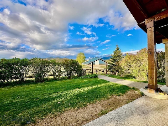 view of property's community with a lawn