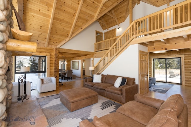 living room with wooden ceiling, beam ceiling, high vaulted ceiling, hardwood / wood-style floors, and log walls