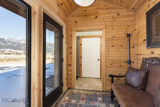 interior space featuring a mountain view, lofted ceiling, and wooden ceiling