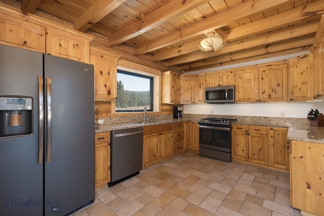 kitchen with light stone counters, appliances with stainless steel finishes, beam ceiling, wood ceiling, and sink