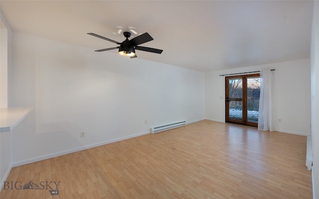 empty room featuring light wood-type flooring, ceiling fan, and baseboard heating