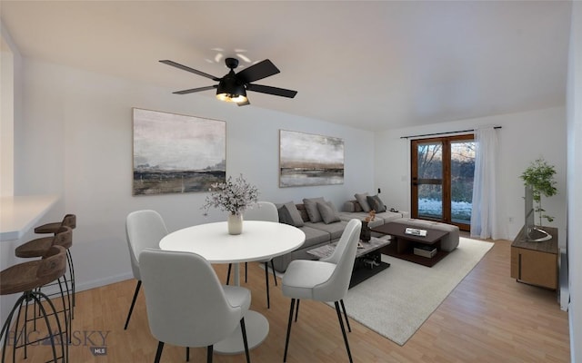 dining space featuring ceiling fan and light hardwood / wood-style flooring