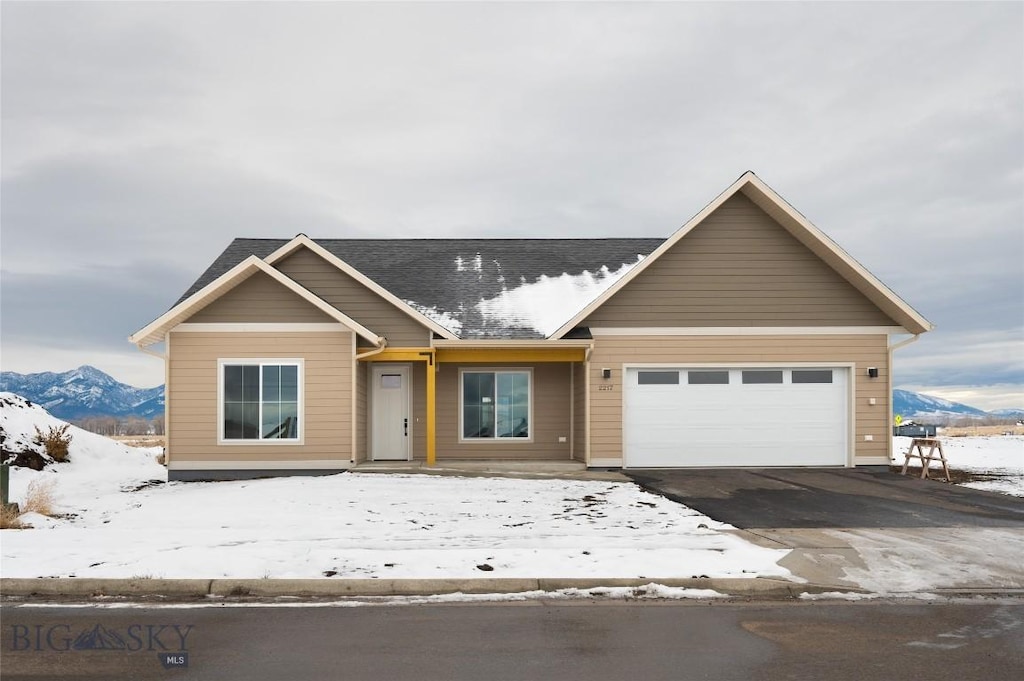 view of front of house with a mountain view and a garage