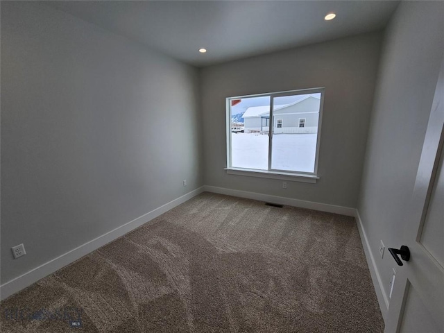 unfurnished room with baseboards, visible vents, carpet flooring, and recessed lighting