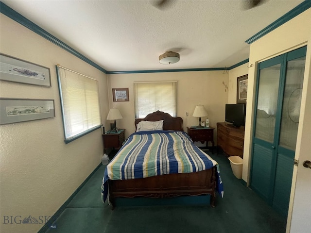 bedroom with a textured ceiling and ornamental molding