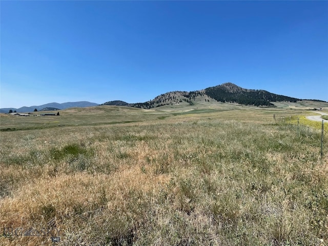 view of mountain feature featuring a rural view