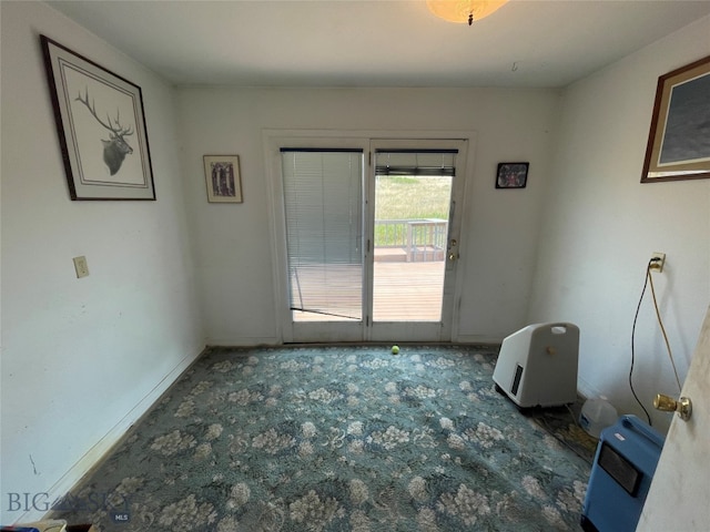 empty room with dark colored carpet