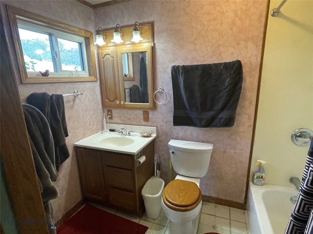 bathroom with tile patterned flooring, a bathtub, vanity, and toilet