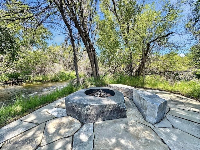 401 Mill Crk, Sheridan, MT 59749 - view of patio / terrace featuring an outdoor fire pit