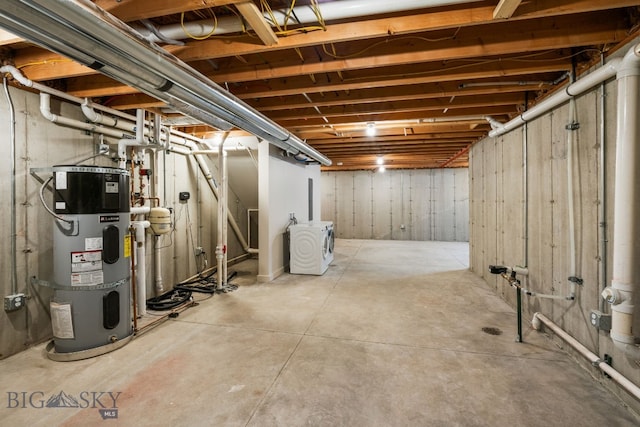 basement with washer / clothes dryer and water heater