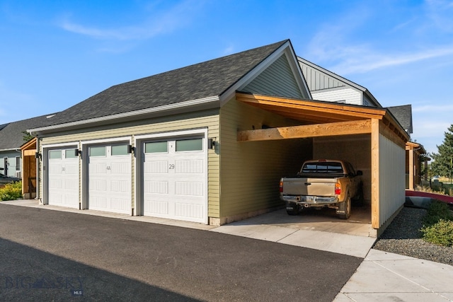 garage featuring a carport