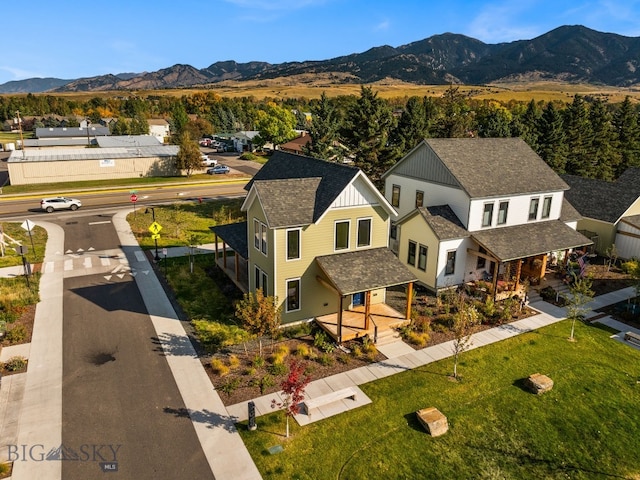 birds eye view of property featuring a mountain view