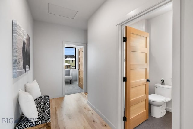 corridor featuring light hardwood / wood-style floors