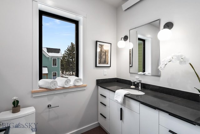 bathroom with vanity and toilet