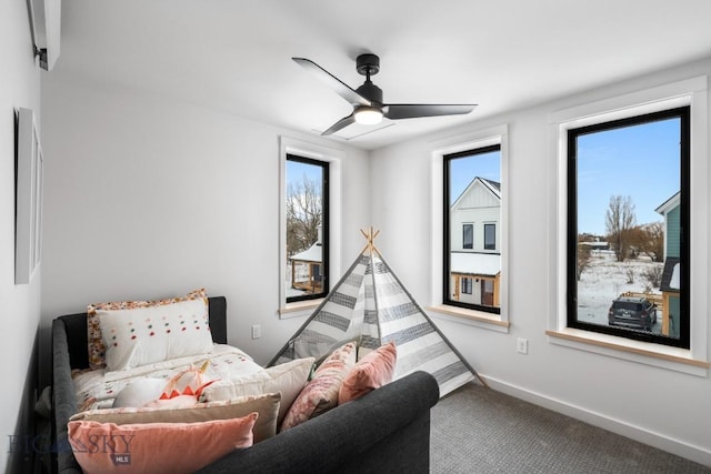 interior space featuring ceiling fan and carpet flooring