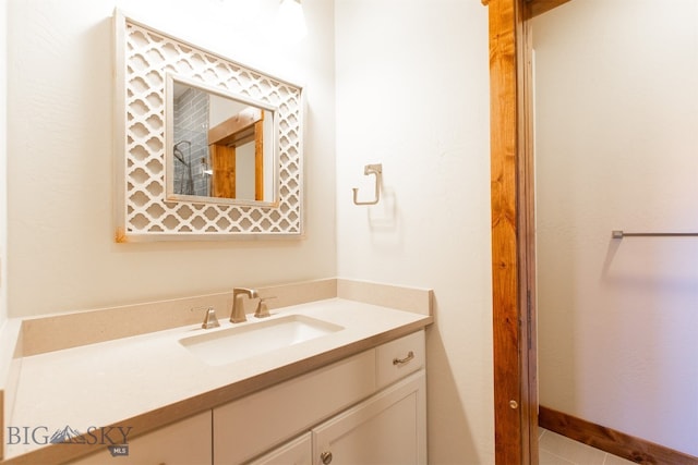 bathroom with tile patterned floors and vanity