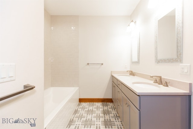 bathroom with vanity and a tub to relax in