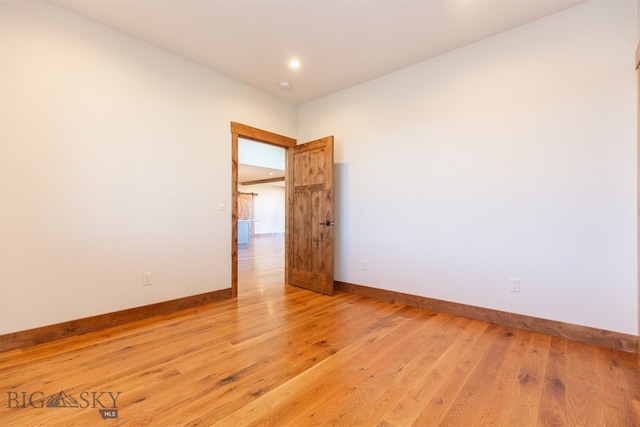 unfurnished room featuring light hardwood / wood-style floors