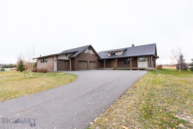 view of front of home with covered porch and a front yard