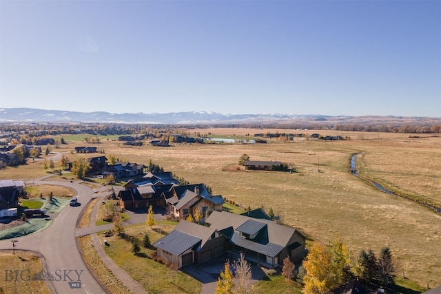 birds eye view of property featuring a mountain view and a rural view