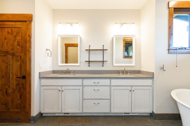 bathroom with vanity and a bathtub