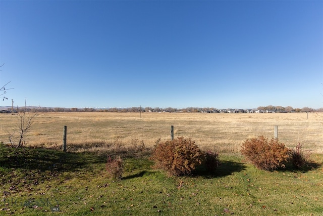 view of yard with a rural view