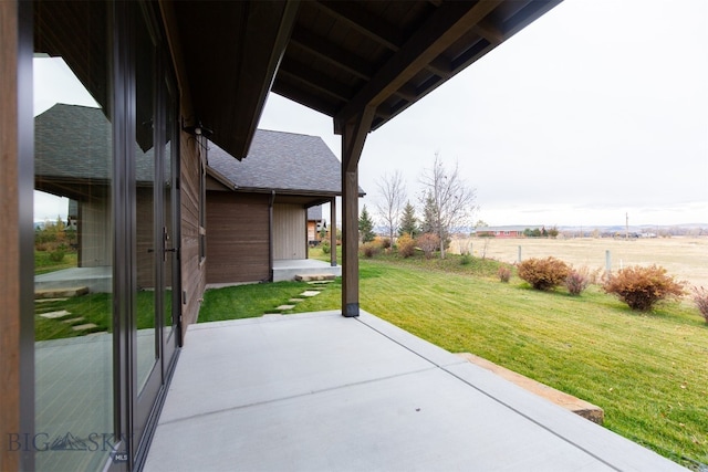 view of patio / terrace with a rural view