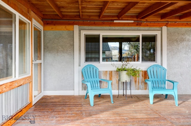 exterior space featuring beam ceiling and wood ceiling