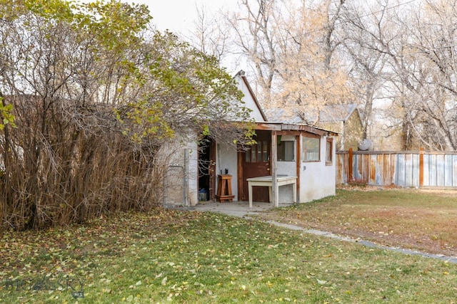 view of outbuilding featuring a yard