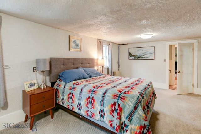 carpeted bedroom with a textured ceiling