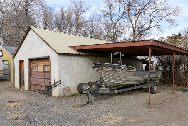 view of vehicle parking featuring a garage