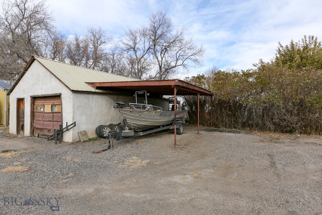 exterior space featuring an outbuilding and a garage