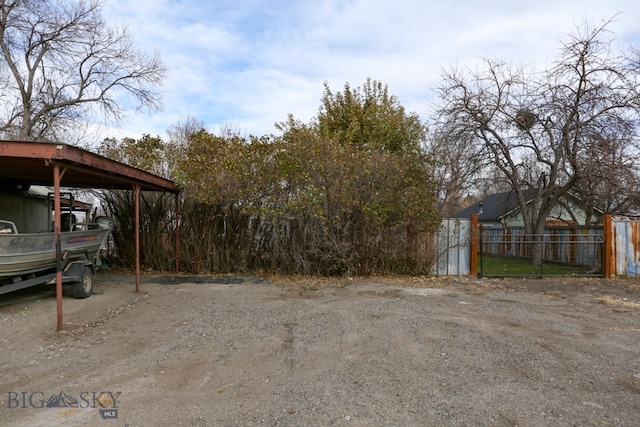 view of yard with a carport