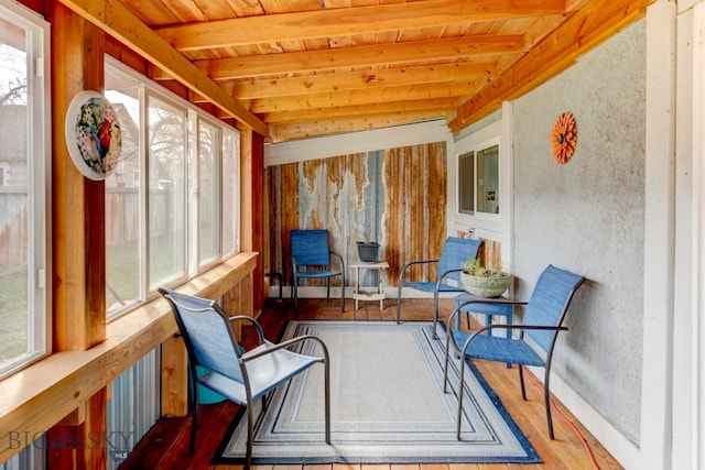 sunroom featuring vaulted ceiling with beams and wooden ceiling