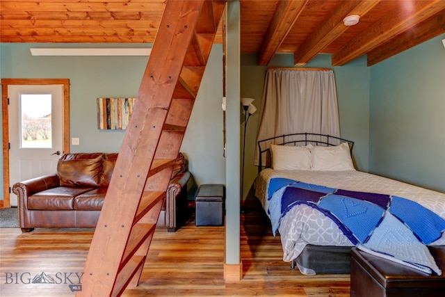 bedroom featuring wood ceiling, beamed ceiling, and light hardwood / wood-style floors