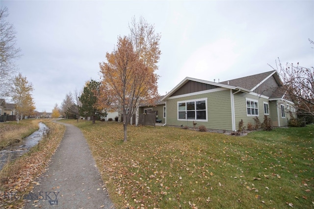 view of home's exterior with a yard