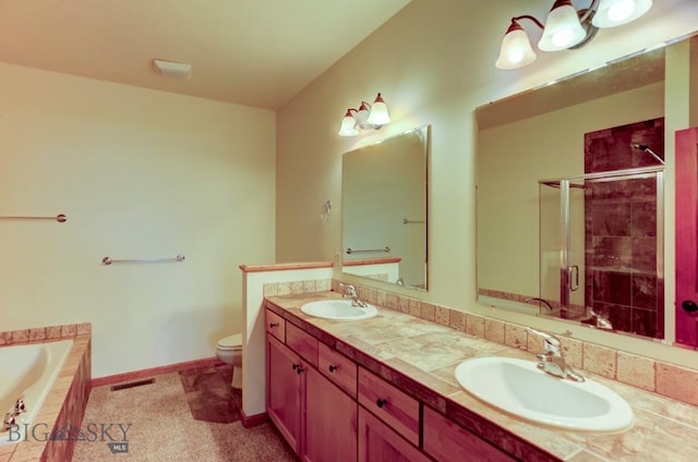 full bathroom with toilet, vanity, and shower with separate bathtub