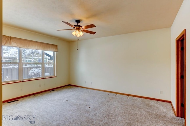 empty room with light carpet and ceiling fan