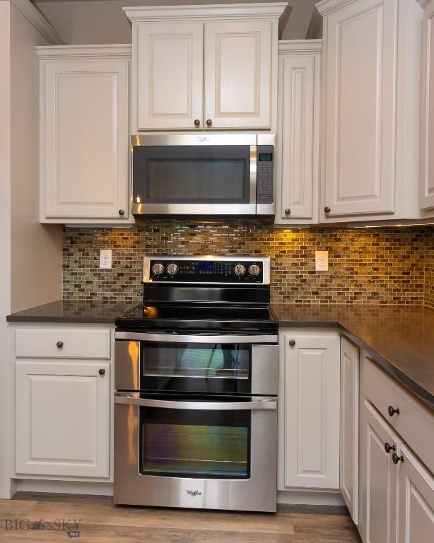 kitchen featuring white cabinetry and stainless steel appliances