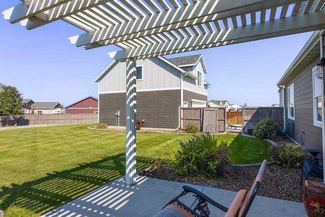 view of yard with a patio area, fence, and a pergola