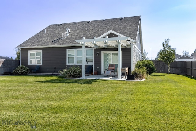 back of property with a patio area, a pergola, and a yard