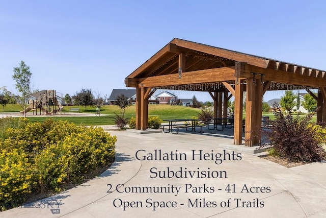 view of property's community with a gazebo and a yard