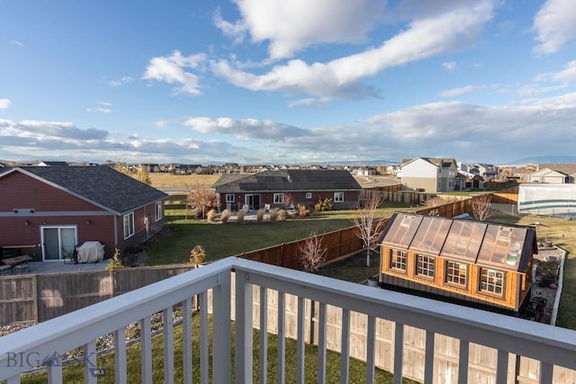 balcony featuring an exterior structure and a residential view